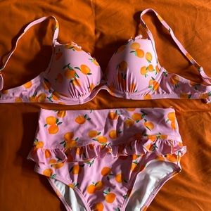 Pink bikini with orange citrus fruit